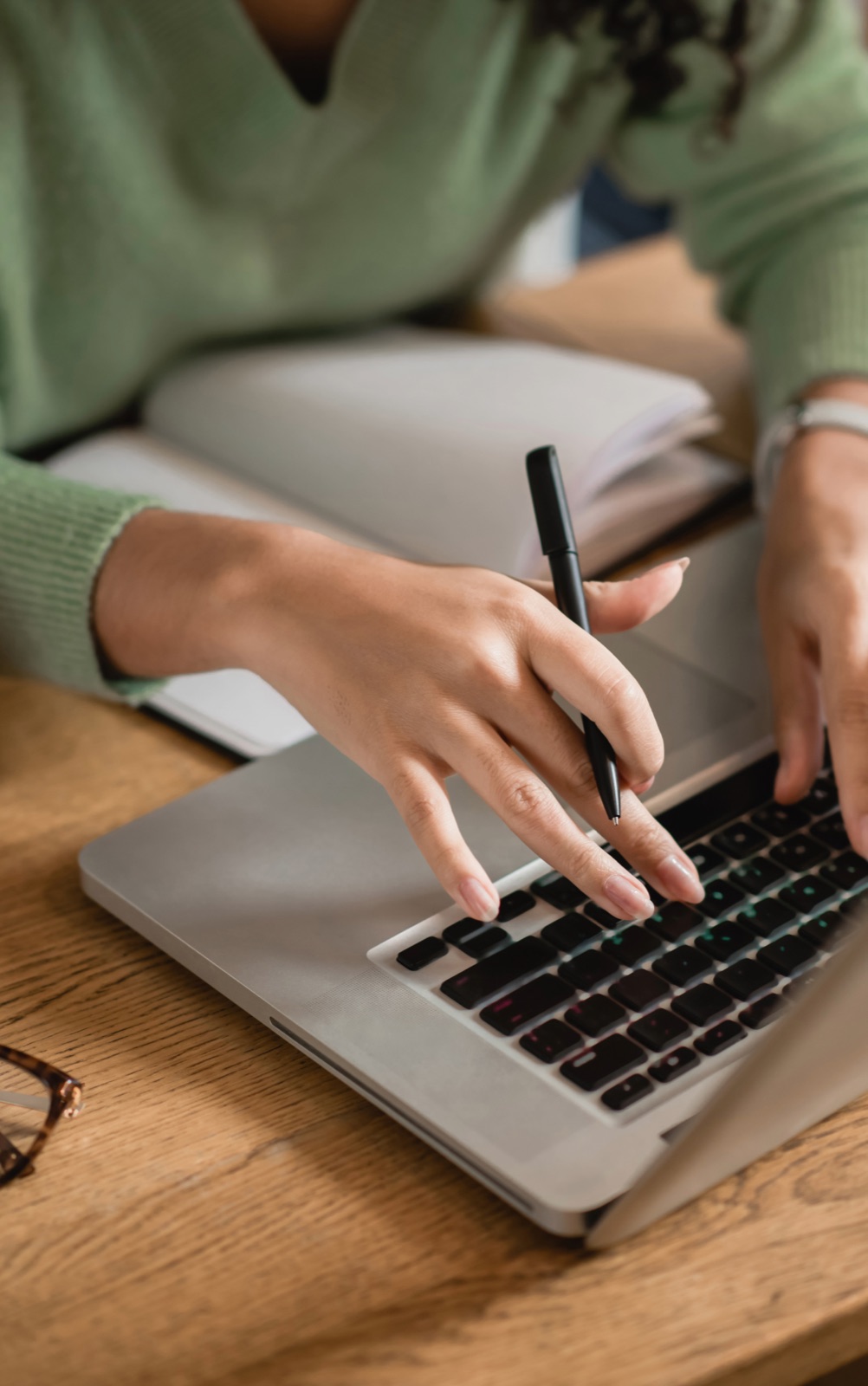 A person comparing insurance options on a laptop