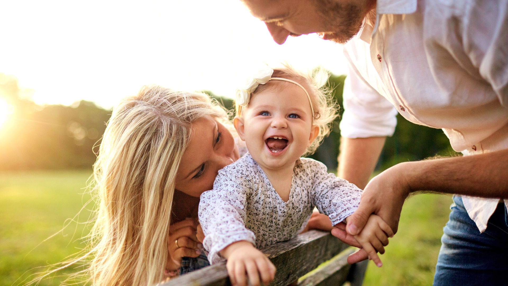 Parents enjoying time outdoors with their baby